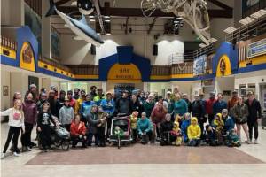 Runners of all ages gather for a photo in the Homer High School Commons after the annual Thanksgiving Turkey Trot on Thursday, Nov. 27, 2025, in Homer, Alaska. Due to icy outdoor conditions, the official run was moved to the high school halls. Photo courtesy Matthew Smith