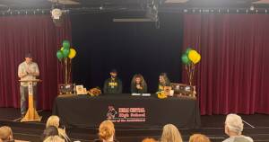 Sophie Tapley is photographed with her parents, Josh and Whitney Tapley, during Sophies signing ceremony at Kenai Central High School on Nov. 26, 2025. Tapley committed to playing volleyball at the University of Alaska Anchorage during the 2026-2027 school year. Photo courtesy of Jesse Settlemyer, Kenai Central Athletics