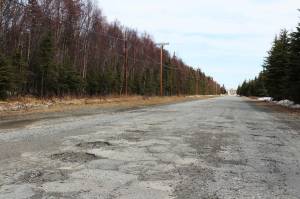 Potholes are seen on Wildwood Drive on Thursday, April 22, 2021, in Kenai<ins>, Alaska</ins>. (Ashlyn OHara/Peninsula Clarion)