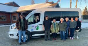 Staff at Soldotna Senior Citizens, Inc. are pictured on Dec. 17, 2025 in Soldotna, Alaska, in front of a new 15-passenger van purchased with funds the Rasmuson Foundation and several local businesses donated to the nonprofit organization. Photo courtesy of Soldotna Senior Citizens, Inc.