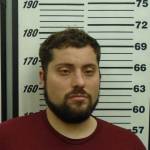 A police mugshot of Kirby Calderwood, 34, of Ogden, Utah, the man charged in the murder and kidnapping of Anesha Duffy Murnane. (Photo provided/Homer Police)