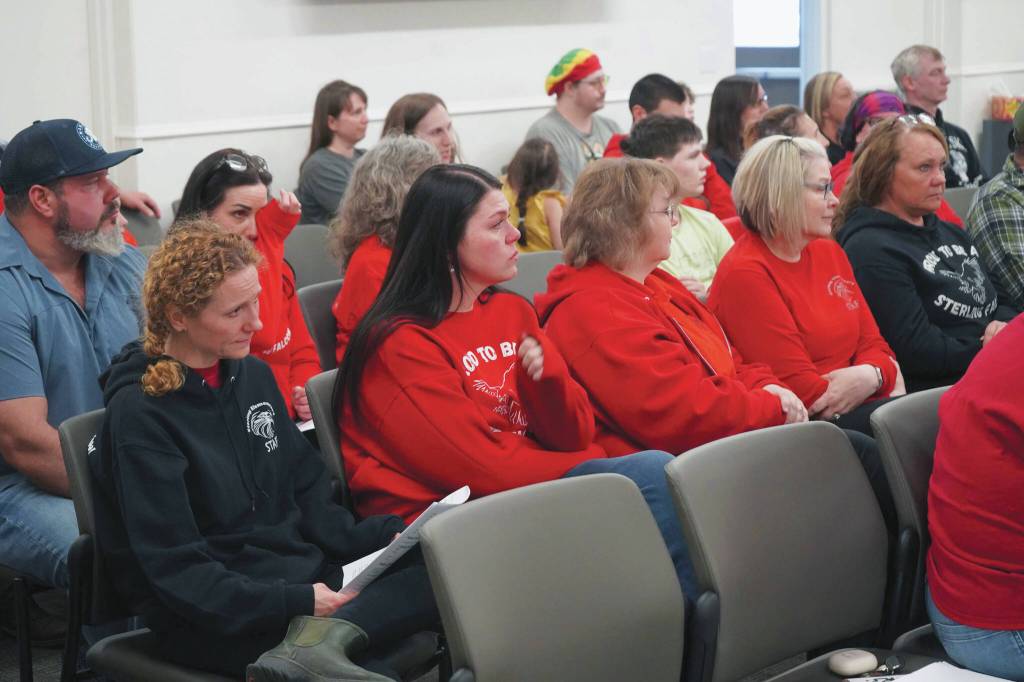 Dozens of supporters of Sterling Elementary School fill the assembly chambers during a special meeting of the Kenai Peninsula Borough School District Board of Education in Soldotna, Alaska, on Wednesday, April 23, 2025. (Jake Dye/Peninsula Clarion)