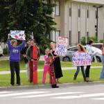 Swimmers and parents protest the proposed closure of Kenai Peninsula Borough School District pools outside of the Kenai Peninsula Borough Administration Building in Soldotna, Alaska, on Thursday, June 26, 2025. (Jake Dye/Peninsula Clarion)