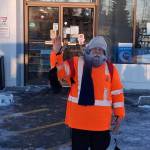 Local resident Jonny Reidy, 70, walks over five miles from his dry cabin in Sterling to the Vitus gas station on the Sterling Highway on Christmas morning. He got a hot chocolate and donned a fluorescent orange jacket over the Santa costume he wore due to the subzero temps before walking back home as part of his project, The 1,000 Mile Walk to Feed the Hungry in America, which asks people to donate anywhere from 10-25 cents to food banks for every mile he walks. Photo courtesy of Jonny Reidy