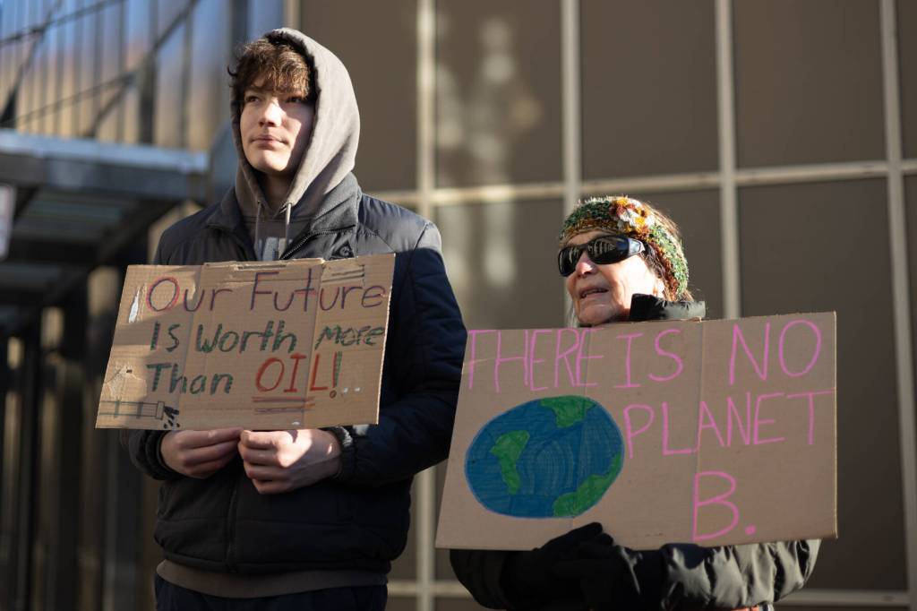 Chloe Anderson / Juneau Empire
Felix Dean protests alongside his grandmother, Shar Fox, during an anti-LNG pipeline demonstration outside the Alaska State Capitol on Saturday, Jan. 24<ins>, 2026</ins>.
