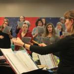 Redoubt Chamber Orchestra Conductor Tammy Vollom-Matturro leads the Kenai Peninsula Singers during a rehearsal on Dec. 11. The choir and orchestra will perform together in the 2017 Evening of Christmas on Friday, Dec. 15. (Photo by Erin Thompson/Peninsula Clarion)